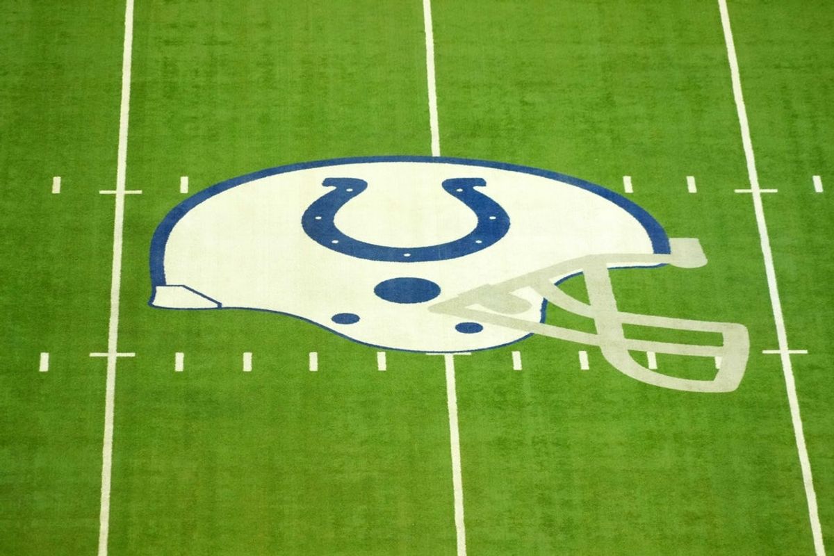 Feb 25, 2025; Indianapolis, IN, USA; The Indianapolis Colts helmet logo at midfield at Lucas Oil Stadium. Mandatory Credit: Kirby Lee-Imagn Images