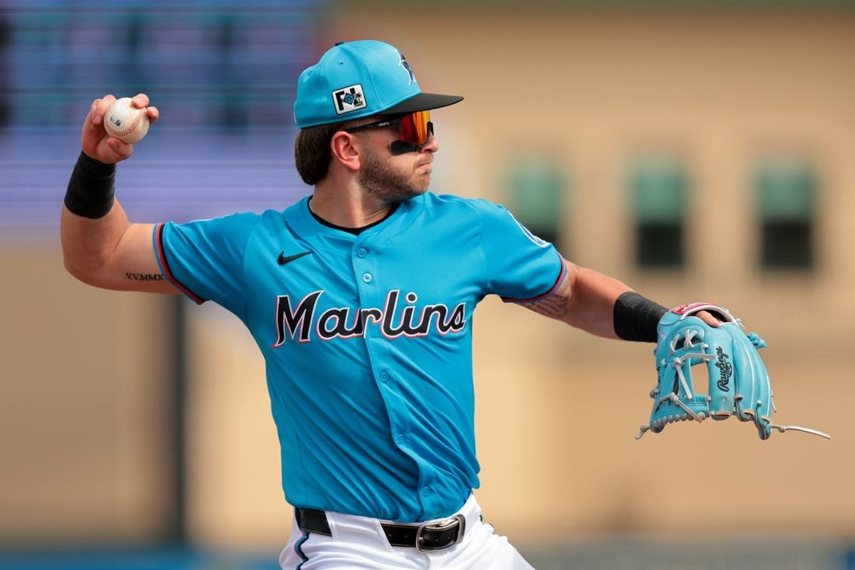 Feb 26, 2025; Jupiter, Florida, USA; Miami Marlins third baseman Connor Norby (1) throws to first base and retires New York Mets designated hitter Chris Williams (not pictured) during the third inning at Roger Dean Chevrolet Stadium. Mandatory Credit: Sam Navarro-Imagn Images