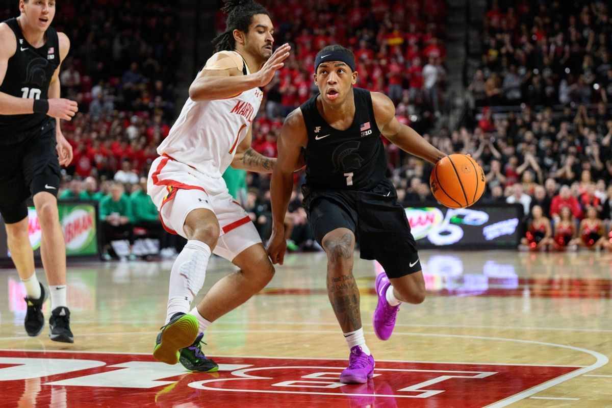 Feb 26, 2025; College Park, Maryland, USA; Michigan State Spartans guard Jeremy Fears Jr. (1) drives to the basket against Maryland Terrapins guard Rodney Rice (1) during the first half at Xfinity Center. Mandatory Credit: Reggie Hildred-Imagn Images
