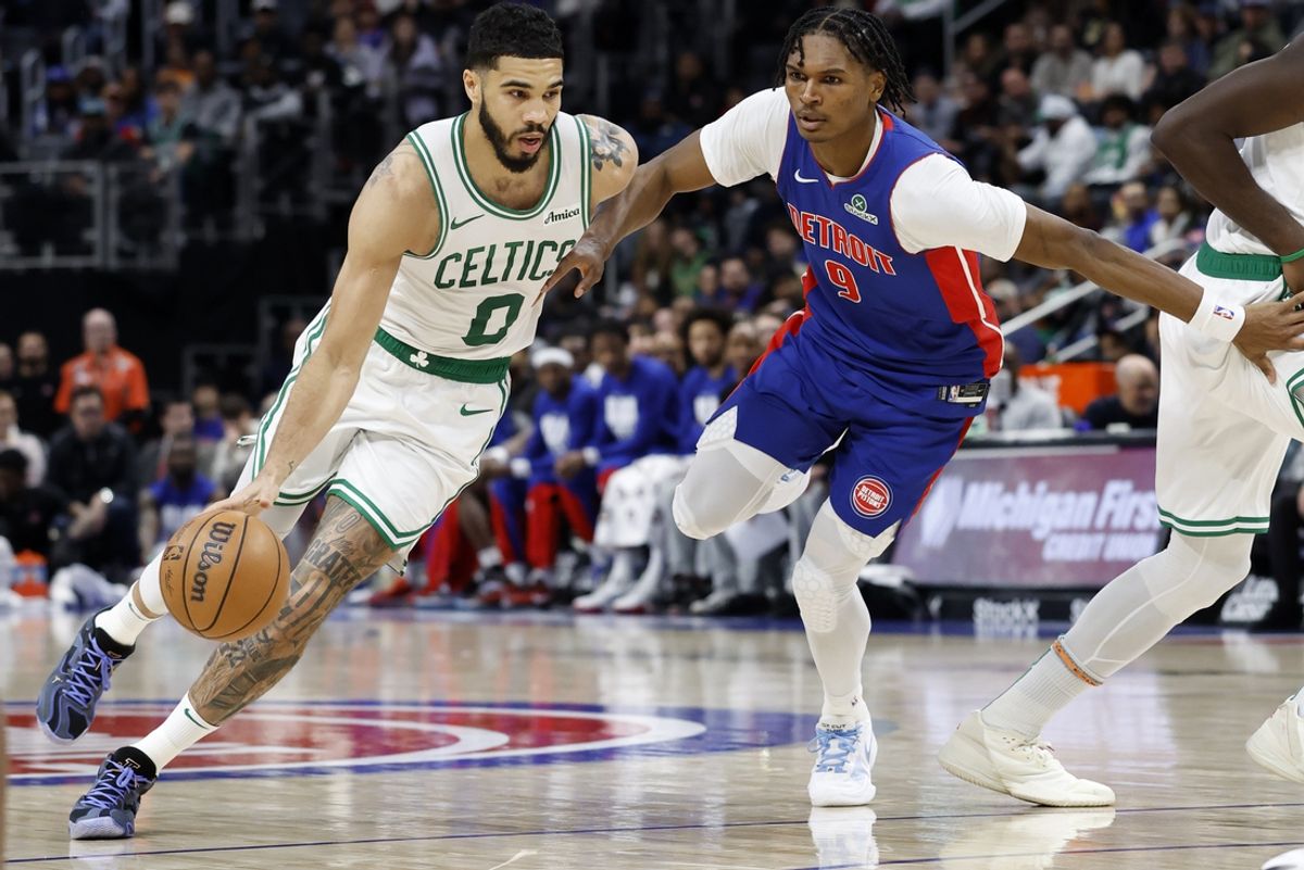 Feb 26, 2025; Detroit, Michigan, USA;  Boston Celtics forward Jayson Tatum (0) dribbles on Detroit Pistons forward Ausar Thompson (9) in the first half at Little Caesars Arena. Mandatory Credit: Rick Osentoski-Imagn Images