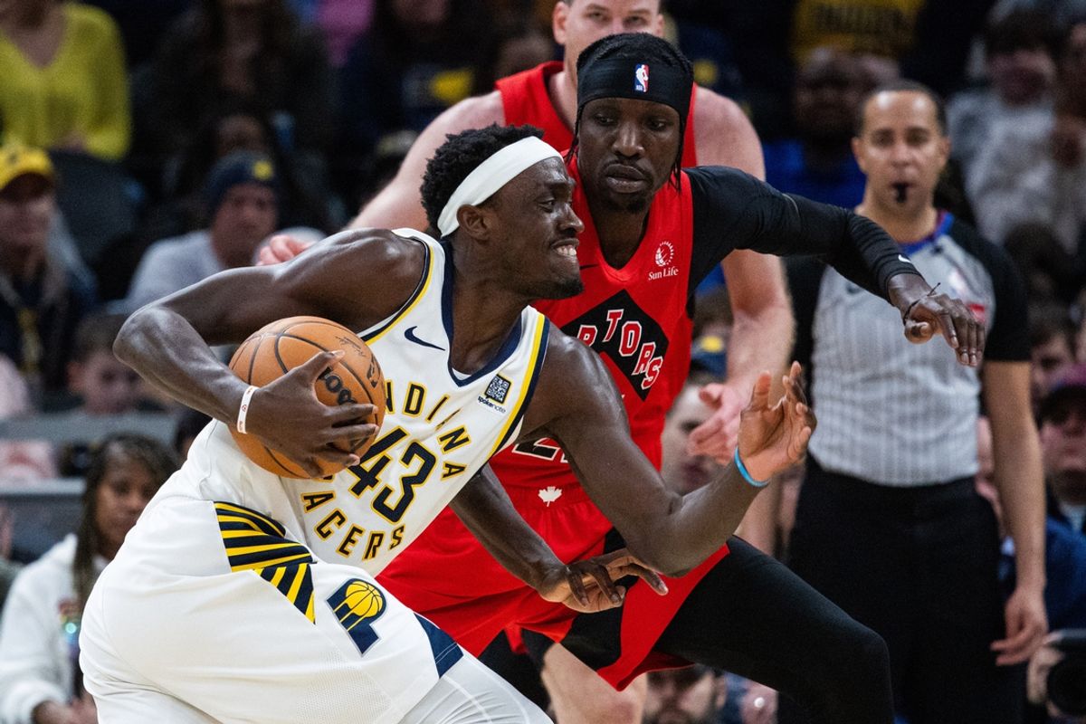 Feb 26, 2025; Indianapolis, Indiana, USA; Indiana Pacers forward Pascal Siakam (43) drives to the basket with the ball while Toronto Raptors center Orlando Robinson (21) defends in the first half at Gainbridge Fieldhouse. Mandatory Credit: Trevor Ruszkowski-Imagn Images