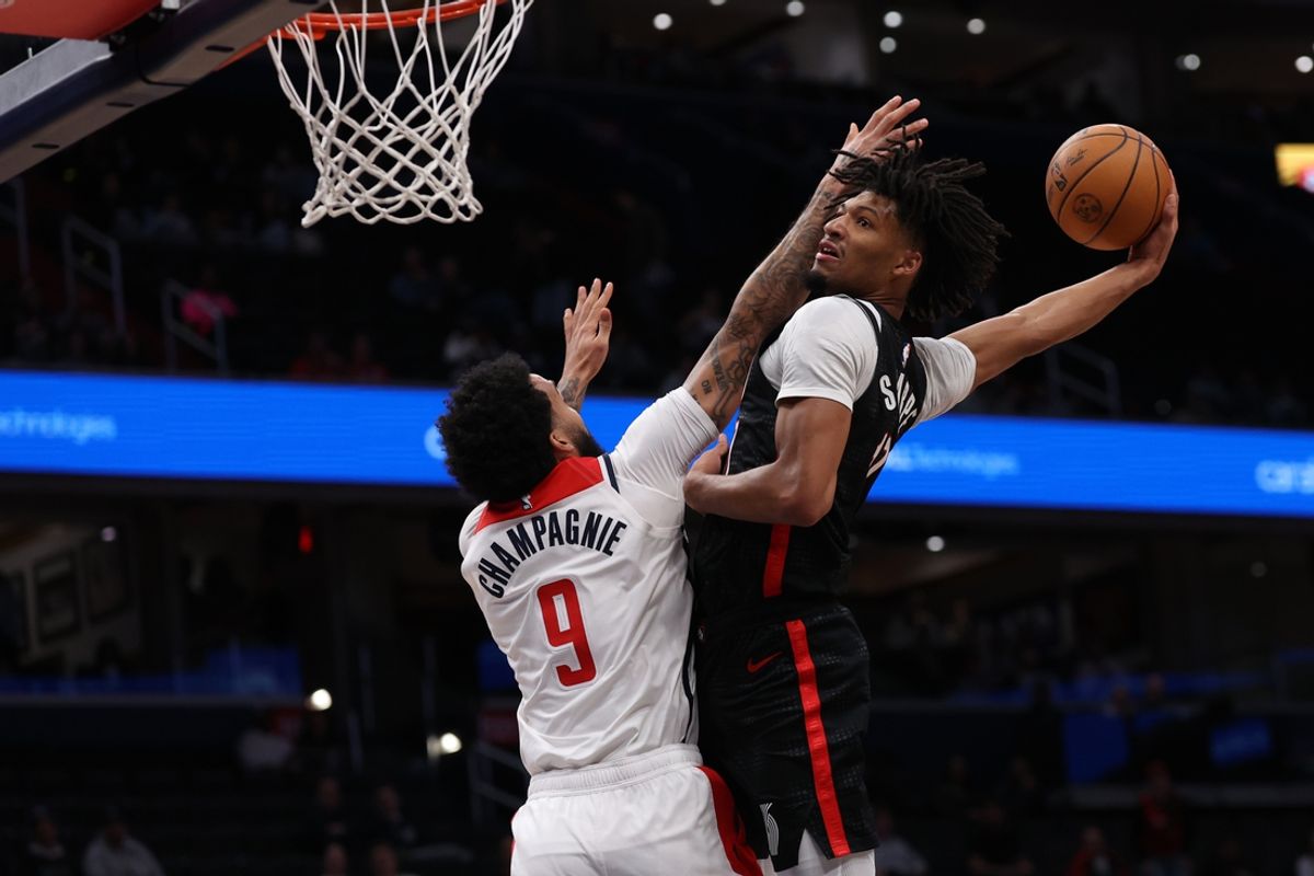 Feb 26, 2025; Washington, District of Columbia, USA; Portland Trail Blazers guard Shaedon Sharpe (17) dunks the ball over Washington Wizards forward Justin Champagnie (9) in the first half at Capital One Arena. Mandatory Credit: Geoff Burke-Imagn Images