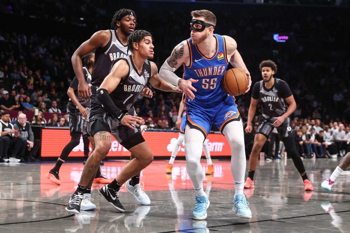 Feb 26, 2025; Brooklyn, New York, USA;  Oklahoma City Thunder center Isaiah Hartenstein (55) looks to drive past Brooklyn Nets guard Killian Hayes (7) in the first quarter at Barclays Center. Mandatory Credit: Wendell Cruz-Imagn Images