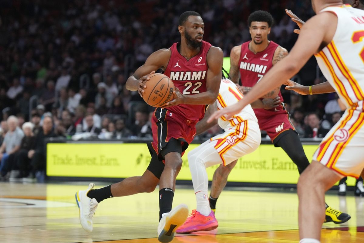 Feb 26, 2025; Miami, Florida, USA;  Miami Heat forward Andrew Wiggins (22) drives to the basket against the Atlanta Hawks in the first half at Kaseya Center. Mandatory Credit: Jim Rassol-Imagn Images