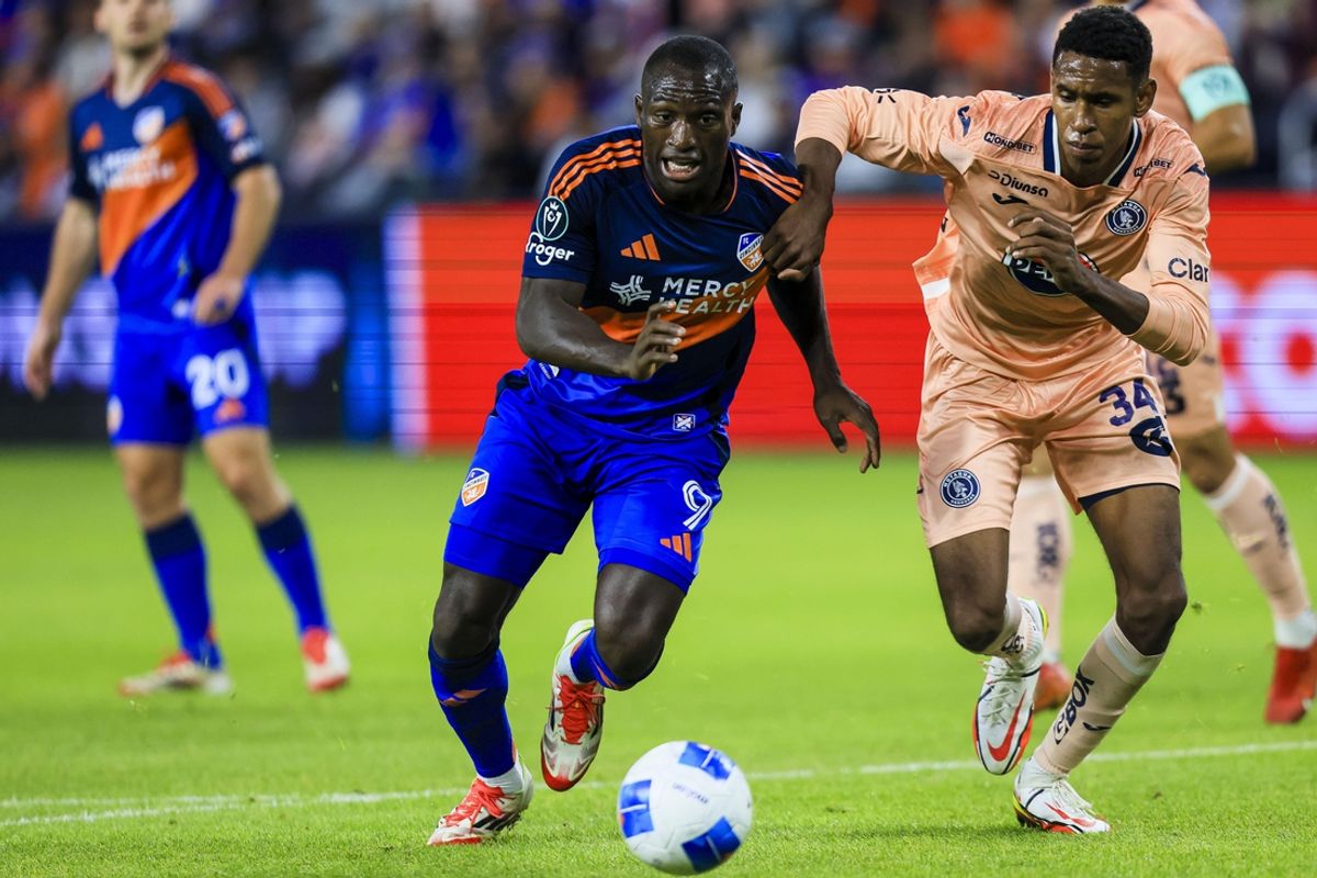 Feb 26, 2025; Cincinnati, Ohio, USA; FC Cincinnati forward Kevin Denkey (9) battles for the ball against FC Motagua defender Giancarlos Sacaza (34) in the first half at TQL Stadium. Mandatory Credit: Katie Stratman-Imagn Images
