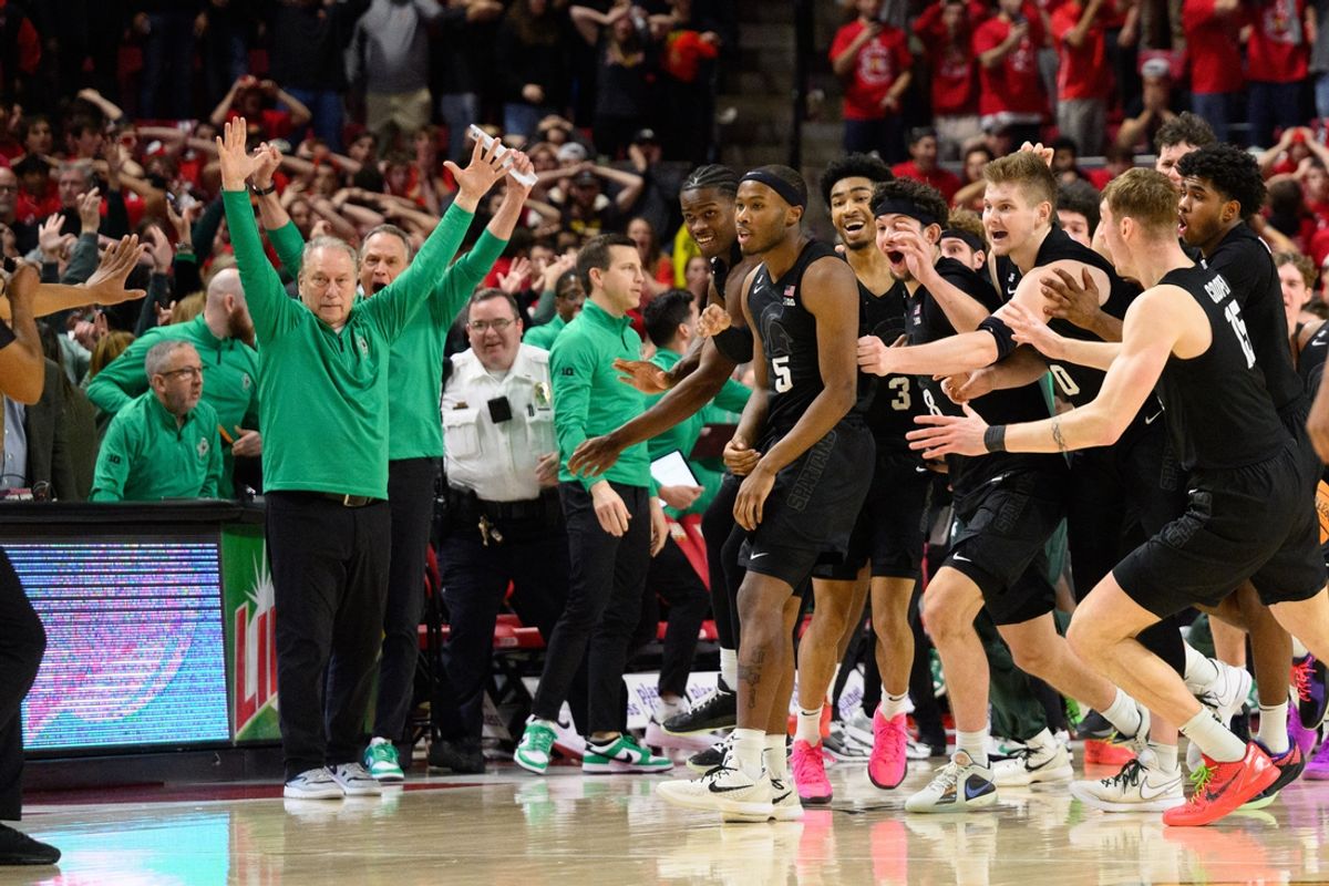 Feb 26, 2025; College Park, Maryland, USA; Michigan State Spartans celebrate after a shot by Michigan State Spartans guard Tre Holloman (5) goes in at the buzzer against the Maryland Terrapins during the second half at Xfinity Center. Mandatory Credit: Reggie Hildred-Imagn Images