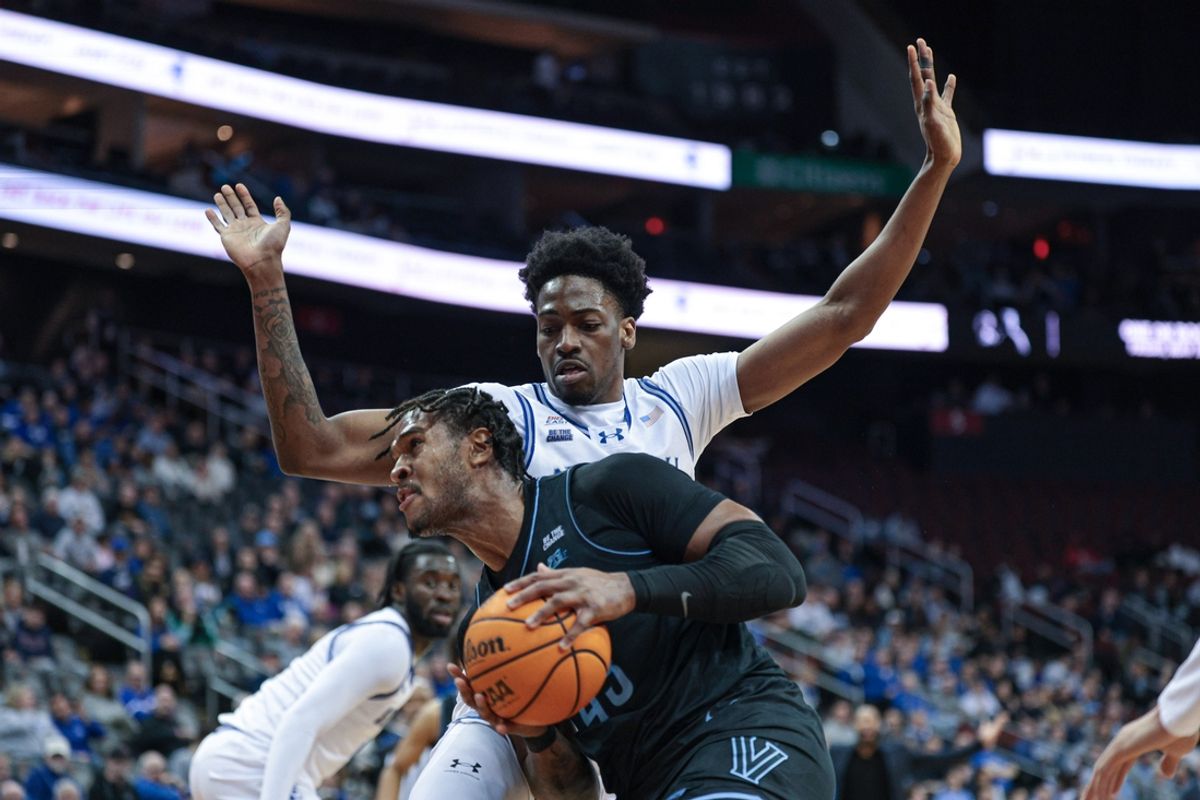 Feb 26, 2025; Newark, New Jersey, USA; Villanova Wildcats forward Eric Dixon (43) goes to the basket against Seton Hall Pirates center Emmanuel Okorafor (23) during the first half at Prudential Center. Mandatory Credit: Vincent Carchietta-Imagn Images