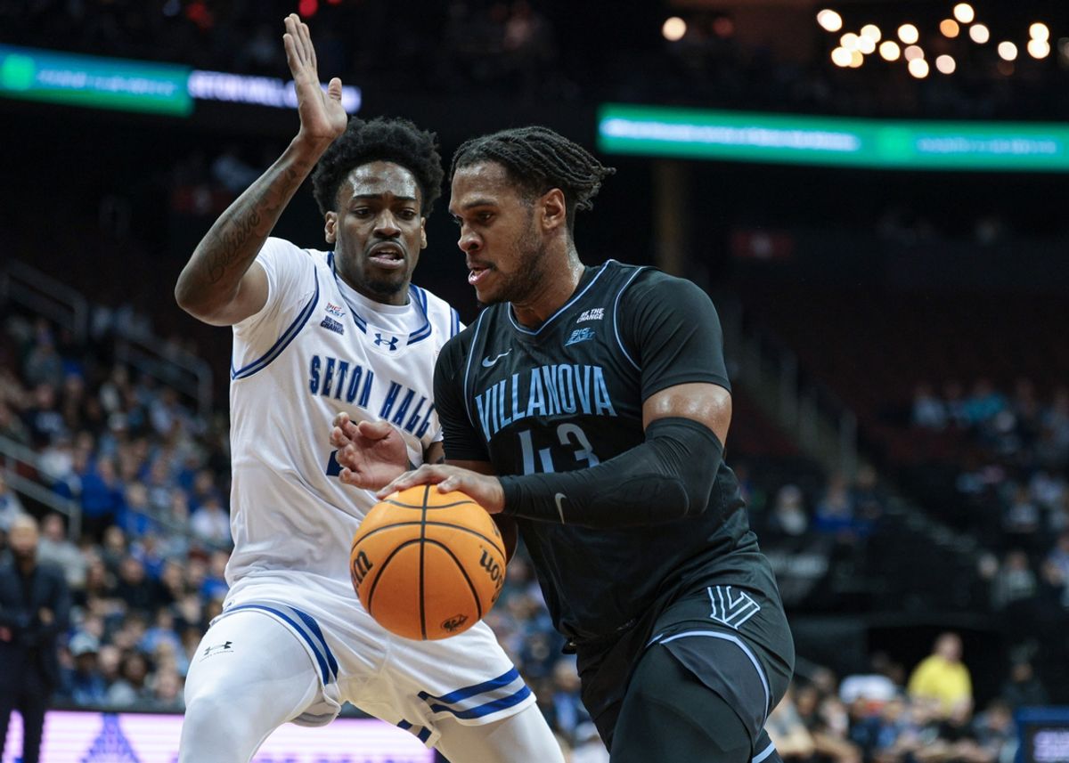 Feb 26, 2025; Newark, New Jersey, USA; Villanova Wildcats forward Eric Dixon (43) goes to the basket against Seton Hall Pirates center Emmanuel Okorafor (23) during the first half at Prudential Center. Mandatory Credit: Vincent Carchietta-Imagn Images