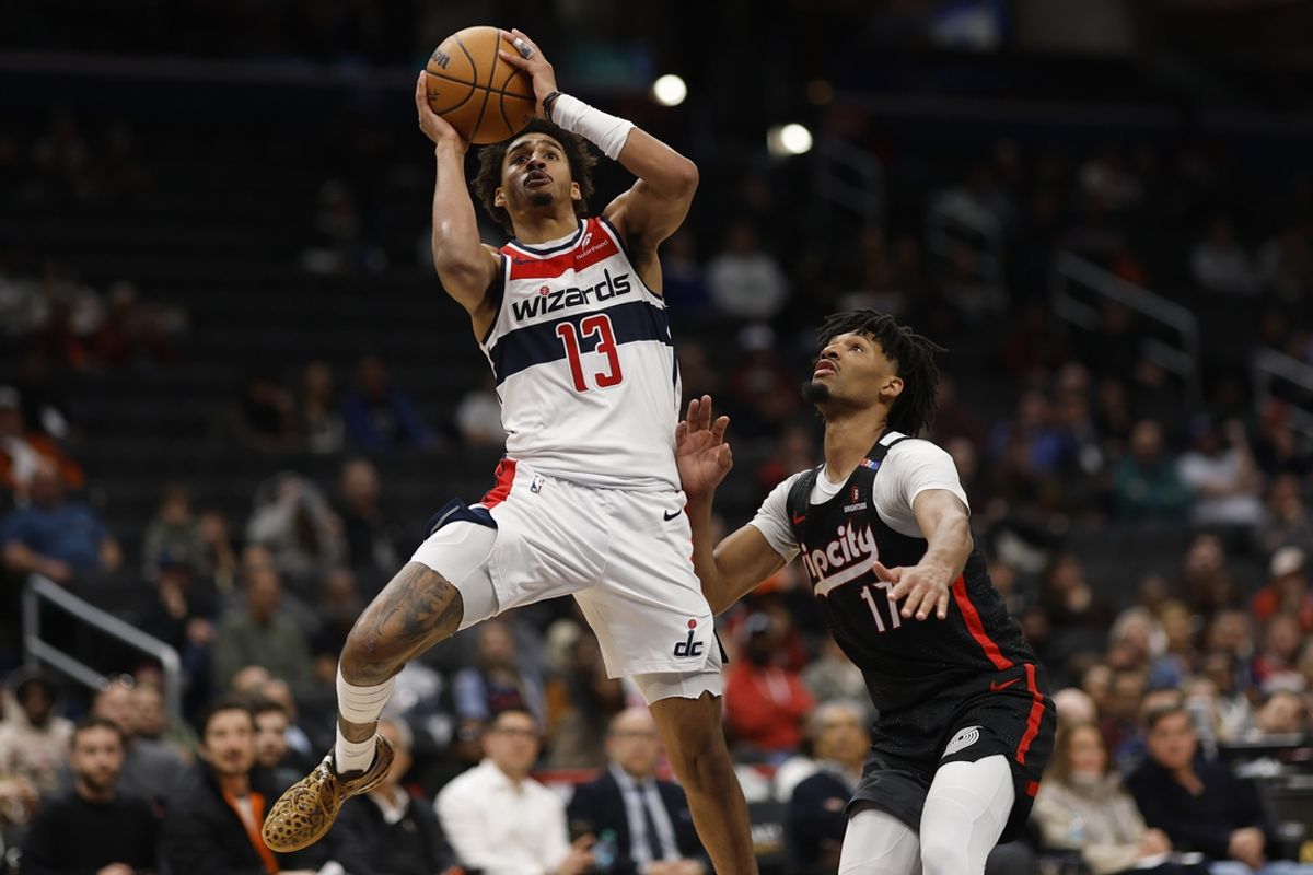 Feb 26, 2025; Washington, District of Columbia, USA; Washington Wizards guard Jordan Poole (13) shoots the ball as Portland Trail Blazers guard Shaedon Sharpe (17) defends in the second half at Capital One Arena. Mandatory Credit: Geoff Burke-Imagn Images