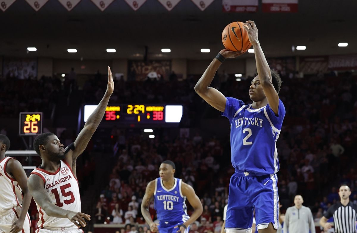 Feb 26, 2025; Norman, Oklahoma, USA; Kentucky Wildcats guard Jaxson Robinson (2) shoots a three point basket as Oklahoma Sooners guard Duke Miles (15) defend during the first half at Lloyd Noble Center. Mandatory Credit: Alonzo Adams-Imagn Images