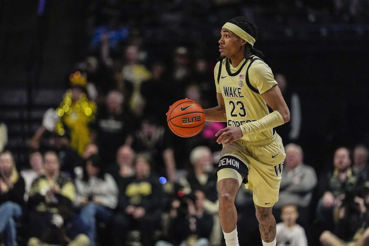 Feb 26, 2025; Winston-Salem, North Carolina, USA; Wake Forest Demon Deacons guard Hunter Sallis (23) brings the ball up court against the Virginia Cavaliers during the first half at Lawrence Joel Veterans Memorial Coliseum. Mandatory Credit: Jim Dedmon-Imagn Images
