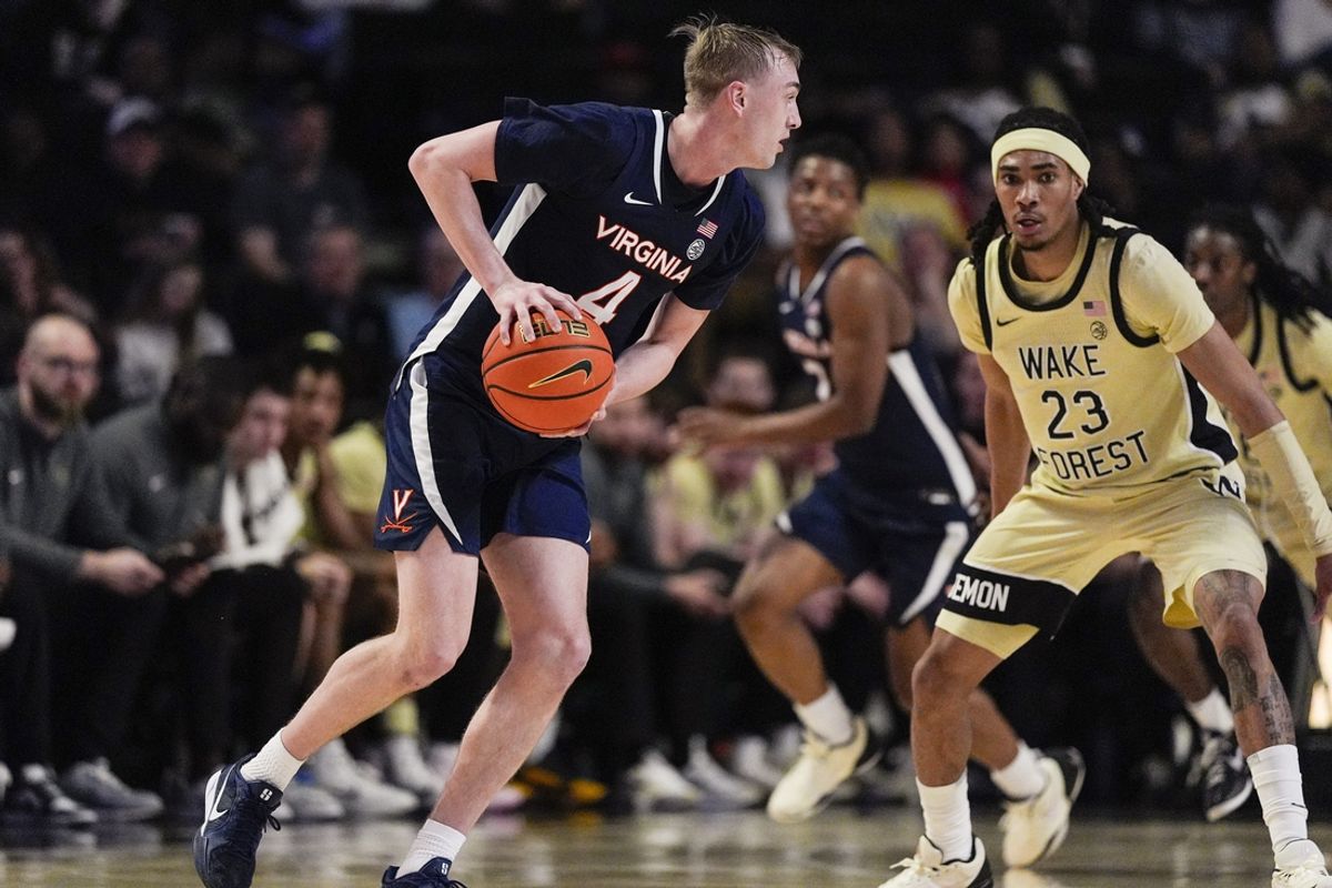 Feb 26, 2025; Winston-Salem, North Carolina, USA; Virginia Cavaliers guard Andrew Rohde (4) handles the ball against Wake Forest Demon Deacons guard Hunter Sallis (23) during the first half at Lawrence Joel Veterans Memorial Coliseum. Mandatory Credit: Jim Dedmon-Imagn Images