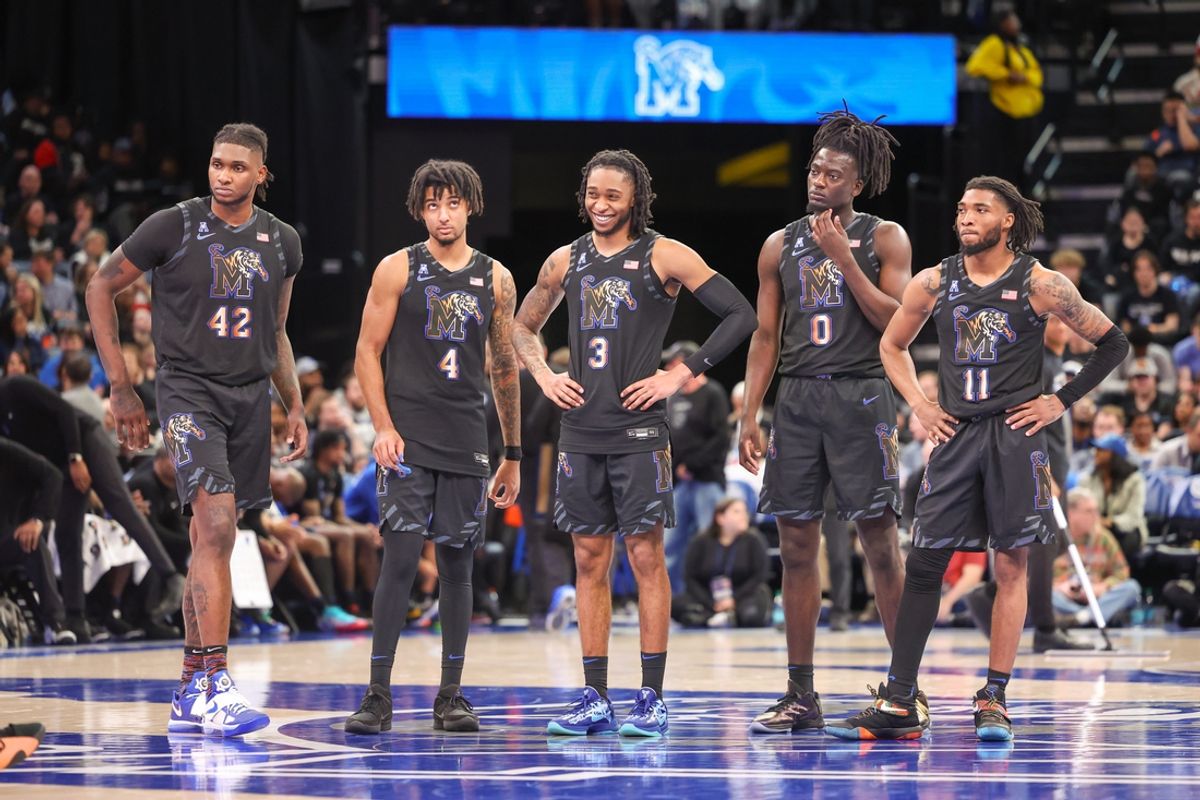 Feb 26, 2025; Memphis, Tennessee, USA; Memphis Tigers forward Dain Dainja (42), guard PJ Haggerty (4), guard Colby Rogers (3), forward Damarien Yates (0), and guard Jared Harris (1) look on against the Rice Owls during the second half at FedExForum. Mandatory Credit: Wesley Hale-Imagn Images
