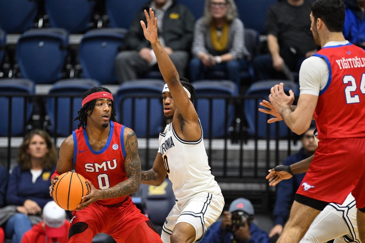 Feb 26, 2025; Berkeley, California, USA; SMU Mustangs guard B.J. Edwards (0) looks for a pass against California Golden Bears guard Jeremiah Wilkinson (0) in the first half at Haas Pavilion. Mandatory Credit: Eakin Howard-Imagn Images