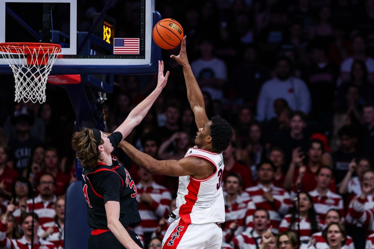 Feb 26, 2025; Tucson, Arizona, USA; Arizona Wildcats forward Tobe Awaka (30) shoots the ball over Utah Utes center Lawson Lovering (34) during the first half at McKale Center. Mandatory Credit: Aryanna Frank-Imagn Images