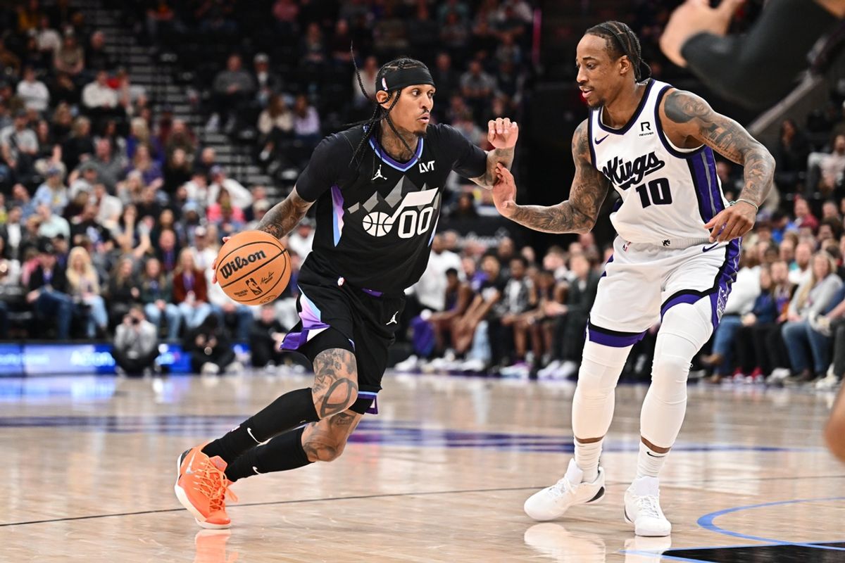 Feb 26, 2025; Salt Lake City, Utah, USA;  Utah Jazz guard Jordan Clarkson (00) controls the ball while being guarded by Sacramento Kings guard DeMar DeRozan (10) in the second half at Delta Center. Mandatory Credit: Jamie Sabau-Imagn Images