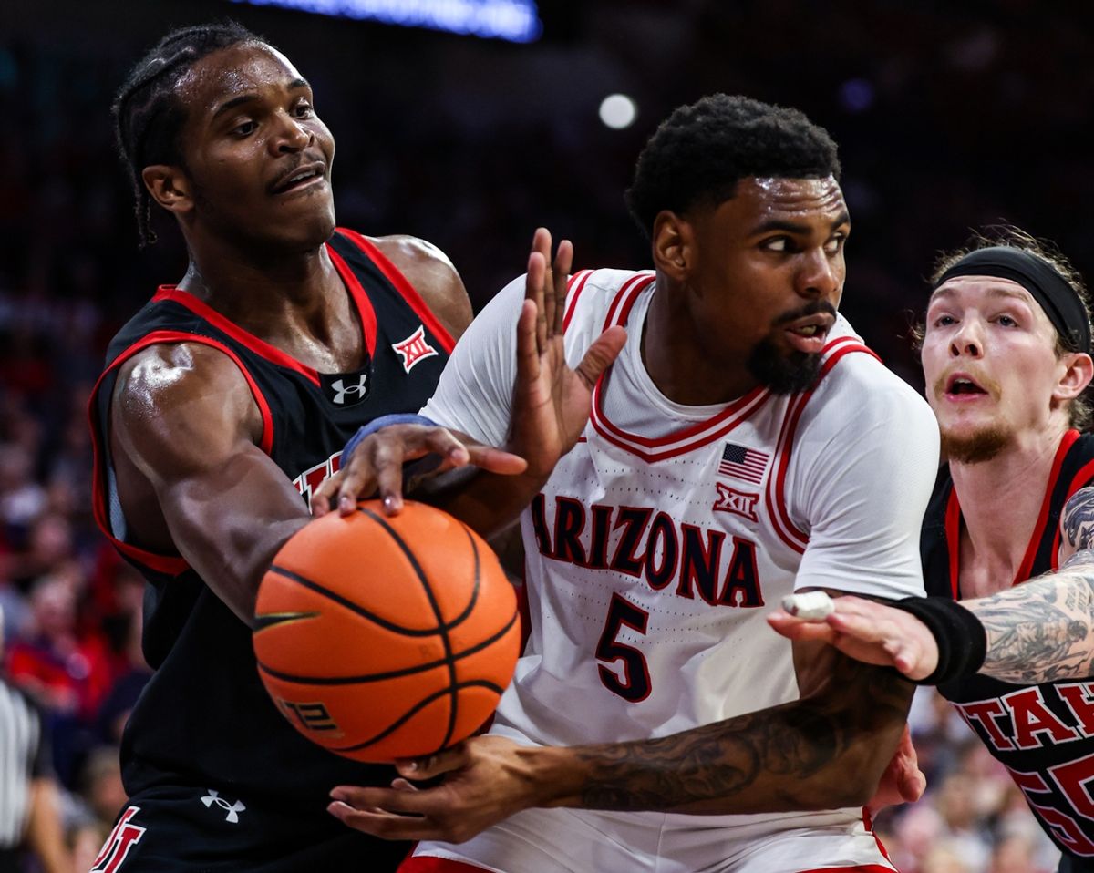 Feb 26, 2025; Tucson, Arizona, USA; Utah Utes forward Ezra Ausar (2) attempts to steal the ball from Arizona Wildcats guard KJ Lewis (5) during the second half at McKale Center. Mandatory Credit: Aryanna Frank-Imagn Images