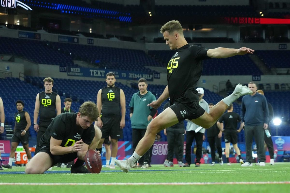 Feb 26, 2025; Indianapolis, IN, USA; Arizona place kicker Tyler Loop (PK05) attempts a field goal during workouts at the 2025 NFL Scouting Combine at Lucas Oil Stadium. Mandatory Credit: Kirby Lee-Imagn Images