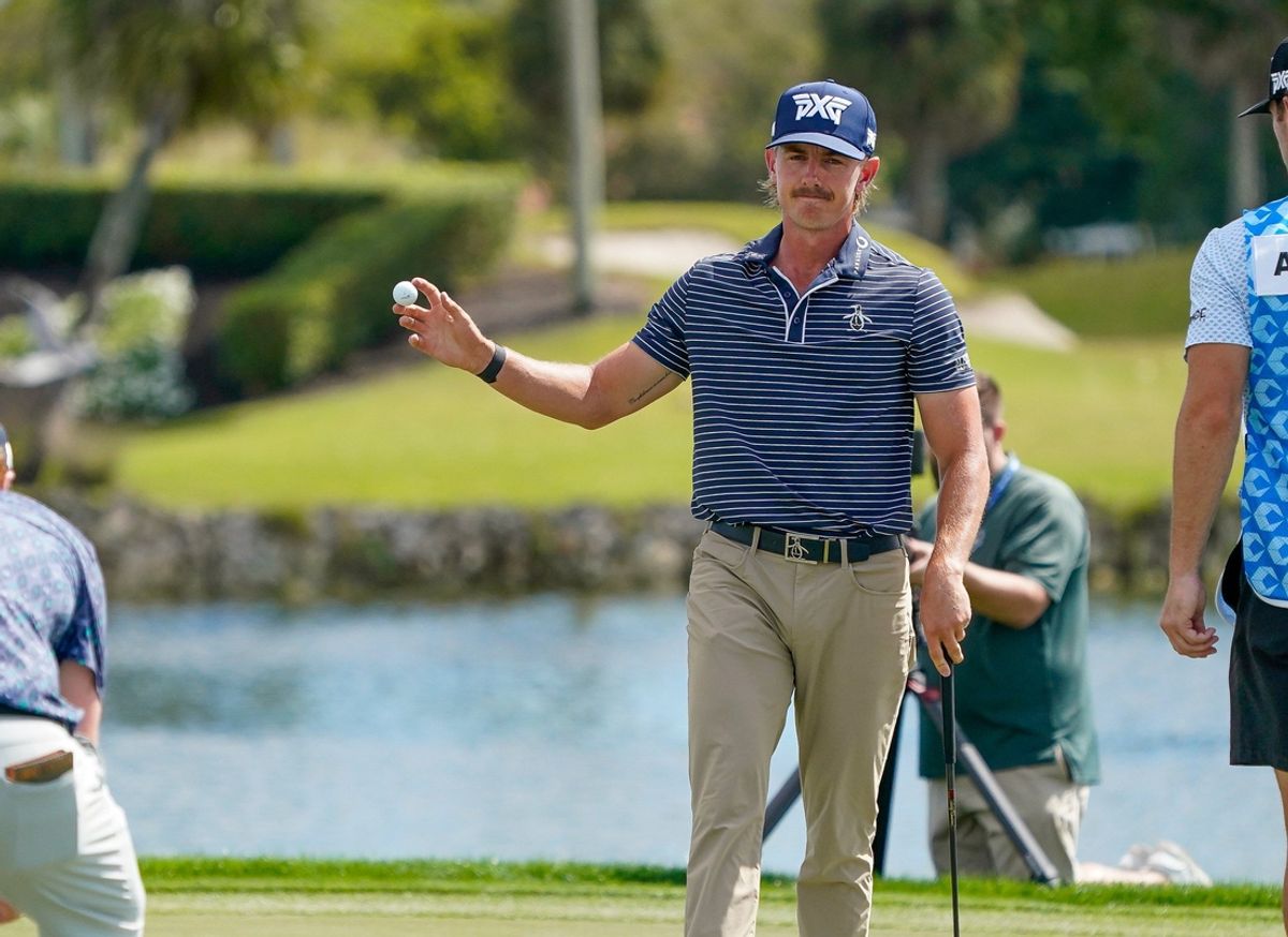 Jake Knapp waves to the crowd after tapping in for birdie on the 18th green for a course-record 59 during the first round of the Cognizant Classic in the Palm Beaches at PGA National Resort & Spa on Thursday, February 27, 2025, in Palm Beach Gardens, FL.
