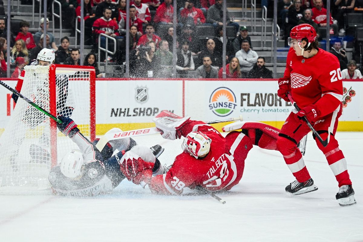 Feb 27, 2025; Detroit, Michigan, USA; Columbus Blue Jackets left wing James van Riemsdyk (21) collides with Detroit Red Wings goaltender Cam Talbot (39) during the first period at Little Caesars Arena. Mandatory Credit: Tim Fuller-Imagn Images