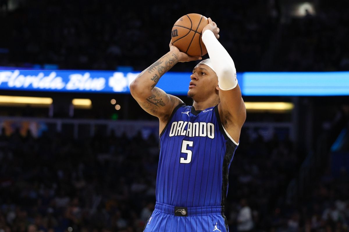 Feb 27, 2025; Orlando, Florida, USA; Orlando Magic forward Paolo Banchero (5) shoots a three point shot against the Golden State Warriors in the second quarter at Kia Center. Mandatory Credit: Nathan Ray Seebeck-Imagn Images