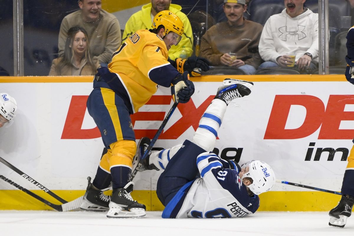 Feb 27, 2025; Nashville, Tennessee, USA;  Nashville Predators defenseman Marc Del Gaizo (7) checks Winnipeg Jets left wing Kyle Connor (81) during the first period at Bridgestone Arena. Mandatory Credit: Steve Roberts-Imagn Images