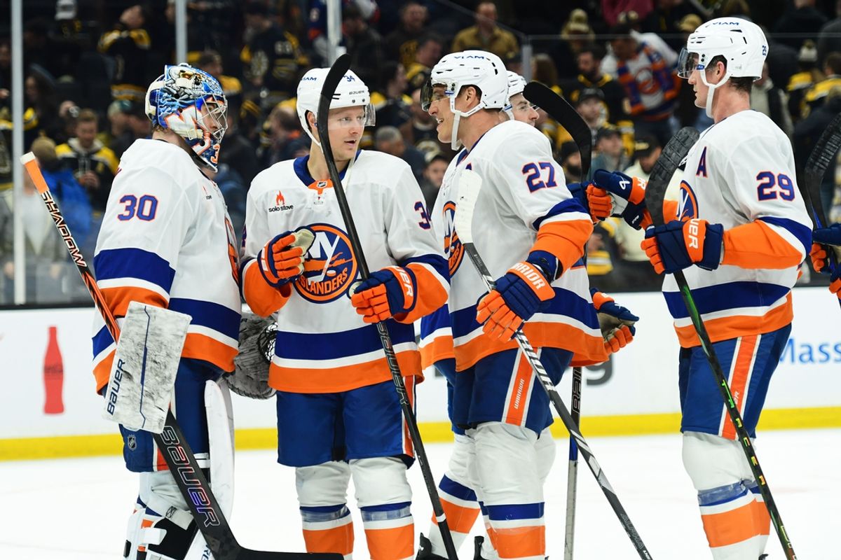 Feb 27, 2025; Boston, Massachusetts, USA; Members of the New York Islanders celebrate their win over the Boston Bruins at TD Garden. Mandatory Credit: Bob DeChiara-Imagn Images