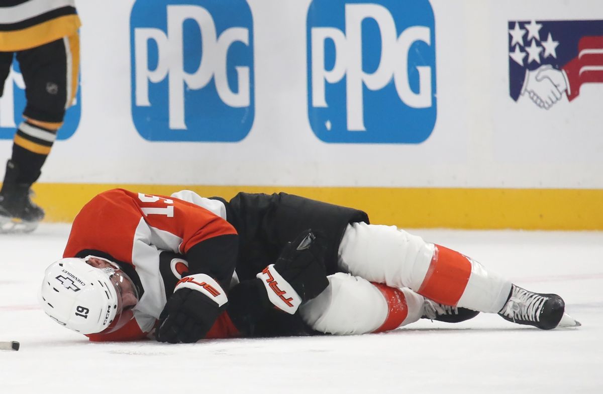 Feb 27, 2025; Pittsburgh, Pennsylvania, USA;  Philadelphia Flyers right wing Garnet Hathaway (19) lays on the ice after suffering an apparent injury after being hit by Pittsburgh Penguins left wing Bokondji Imama (not pictured) during the second period at PPG Paints Arena. Mandatory Credit: Charles LeClaire-Imagn Images