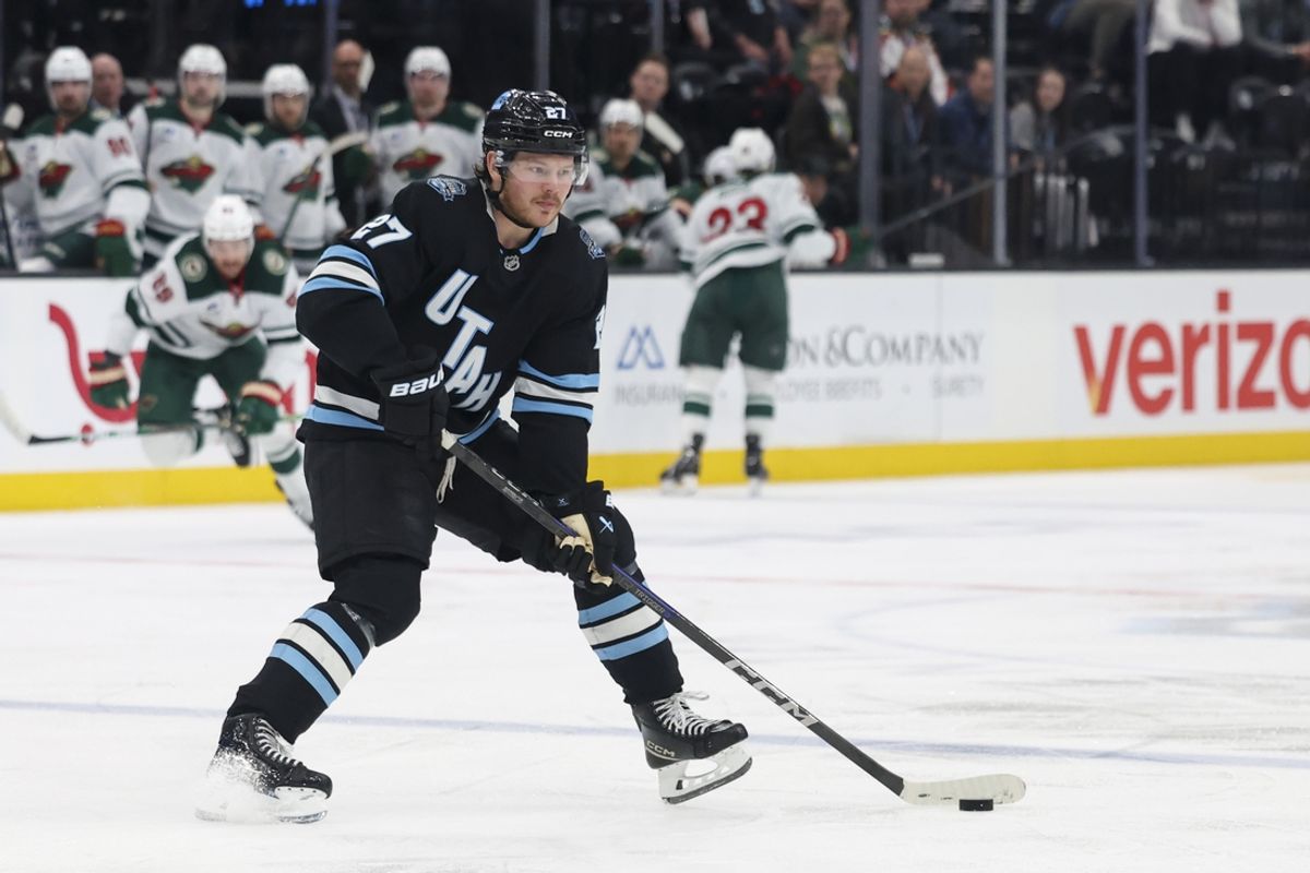 Feb 27, 2025; Salt Lake City, Utah, USA; Utah Hockey Club center Barrett Hayton (27) skates with the puck against the Minnesota Wild during the second period at Delta Center. Mandatory Credit: Rob Gray-Imagn Images