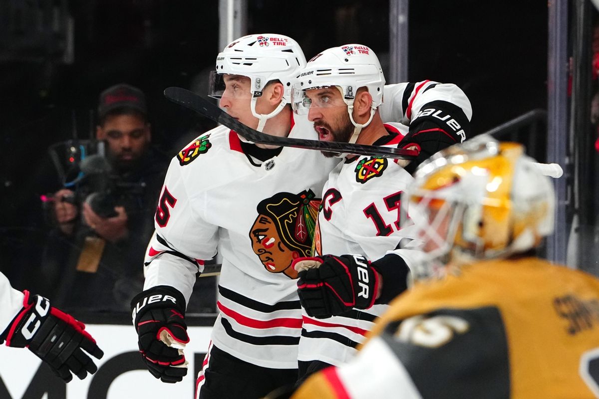 Feb 27, 2025; Las Vegas, Nevada, USA; Chicago Blackhawks left wing Nick Foligno (17) celebrates with  defenseman Connor Murphy (5) after scoring a goal against the Vegas Golden Knights during the first period at T-Mobile Arena. Mandatory Credit: Stephen R. Sylvanie-Imagn Images