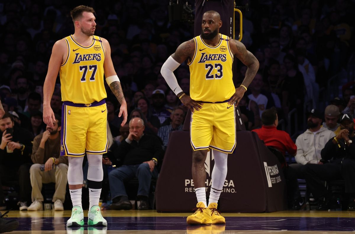 Feb 27, 2025; Los Angeles, California, USA; Los Angeles Lakers guard Luka Doncic (77) and forward LeBron James (23) during the second quarter against the Minnesota Timberwolves at Crypto.com Arena. Mandatory Credit: Jason Parkhurst-Imagn Images