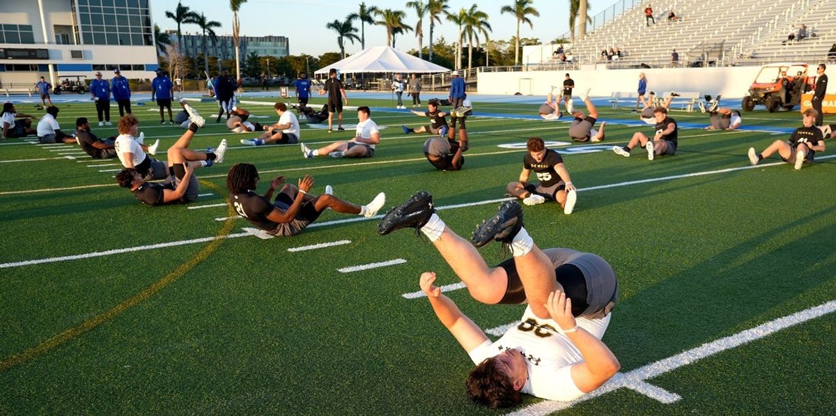 Class of 2026 players start the stretch and testing drills during IMG's Academy Pro Day held at IMG's football field in Bradenton, FL on Thursday, Feb, 27, 2025.