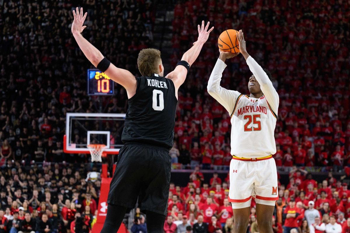 Feb 26, 2025; College Park, Maryland, USA; Maryland Terrapins center Derik Queen (25) takes a jump shot over Michigan State Spartans forward Jaxon Kohler (0) during the second half at Xfinity Center. Mandatory Credit: Reggie Hildred-Imagn Images