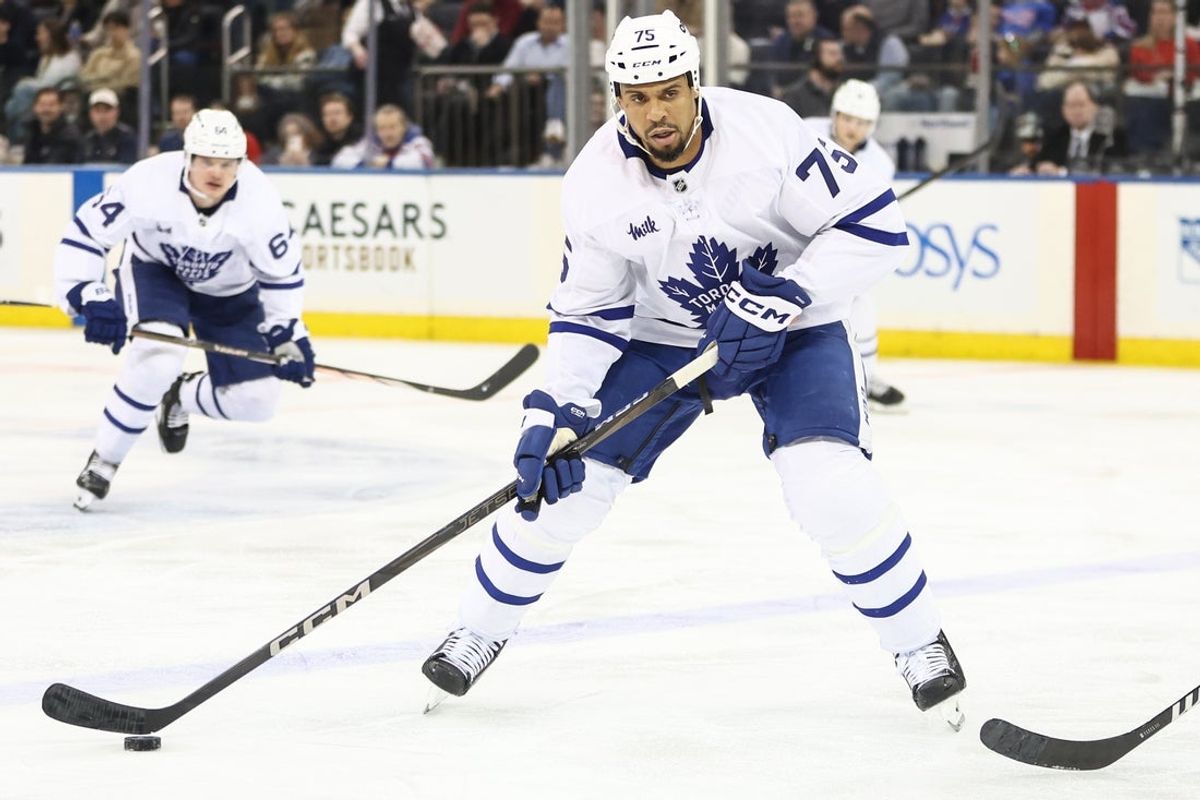Feb 28, 2025; New York, New York, USA;  Toronto Maple Leafs right wing Ryan Reaves (75) controls the puck in the second period against the New York Rangers at Madison Square Garden. Mandatory Credit: Wendell Cruz-Imagn Images
