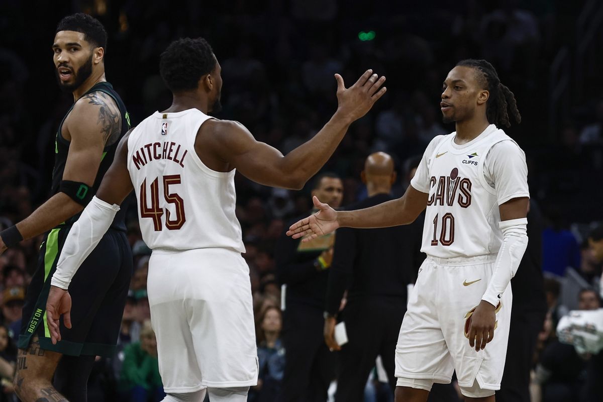 Feb 28, 2025; Boston, Massachusetts, USA; Cleveland Cavaliers guard Donovan Mitchell (45) and guard Darius Garland (10) congratulate each other as Boston Celtics forward Jayson Tatum (0) looks back during the second half at TD Garden. Mandatory Credit: Winslow Townson-Imagn Images