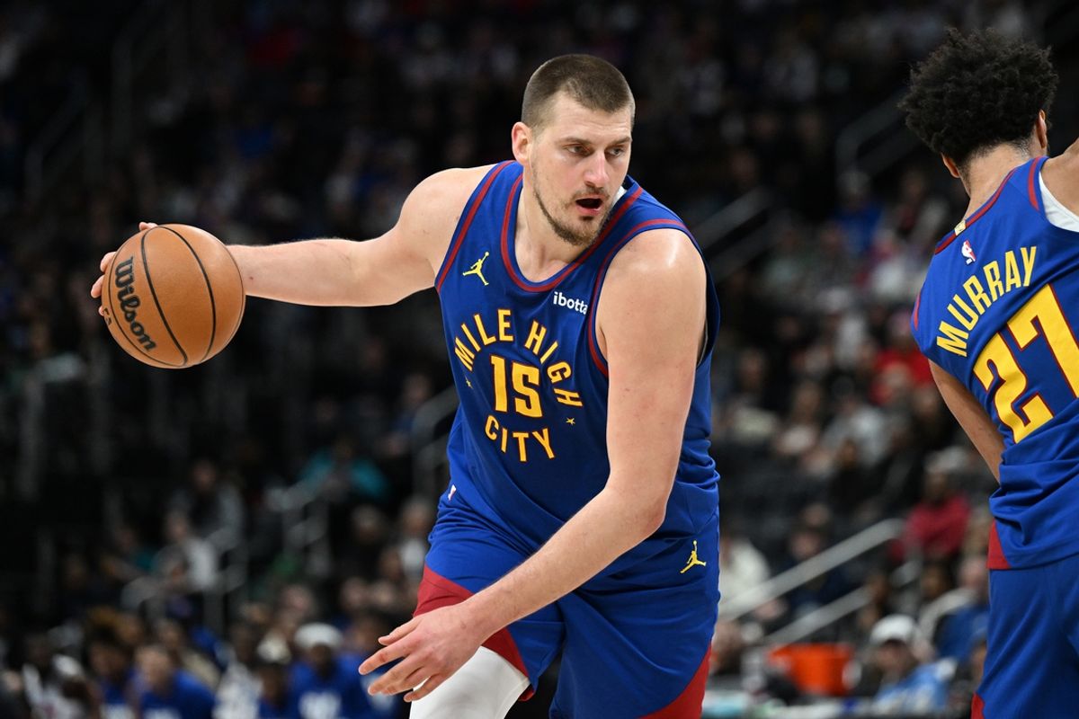 Feb 28, 2025; Detroit, Michigan, USA;  Denver Nuggets center Nikola Jokic (15) gets ready to drive to the basket against the Detroit Pistons  in the first quarter at Little Caesars Arena. Mandatory Credit: Lon Horwedel-Imagn Images