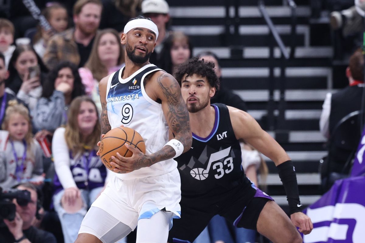 Feb 28, 2025; Salt Lake City, Utah, USA; Minnesota Timberwolves guard Nickeil Alexander-Walker (9) posts up against Utah Jazz guard Johnny Juzang (33) during the second quarter at Delta Center. Mandatory Credit: Rob Gray-Imagn Images