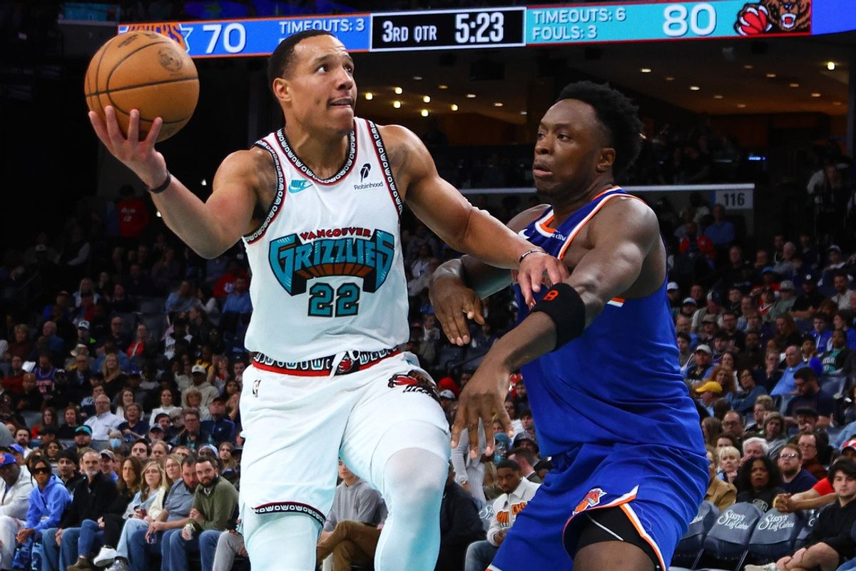 Feb 28, 2025; Memphis, Tennessee, USA; Memphis Grizzlies guard Desmond Bane (22) drives to the basket as New York Knicks forward OG Anunoby (8) defendsduring the third quarter at FedExForum. Mandatory Credit: Petre Thomas-Imagn Images