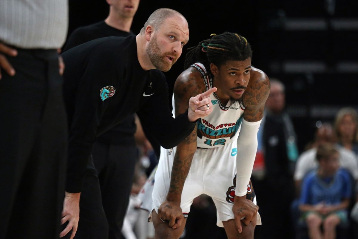 Feb 28, 2025; Memphis, Tennessee, USA; Memphis Grizzlies head coach Taylor Jenkins (left) talks with guard Ja Morant (12) during the third quarter against the New York Knicks at FedExForum. Mandatory Credit: Petre Thomas-Imagn Images