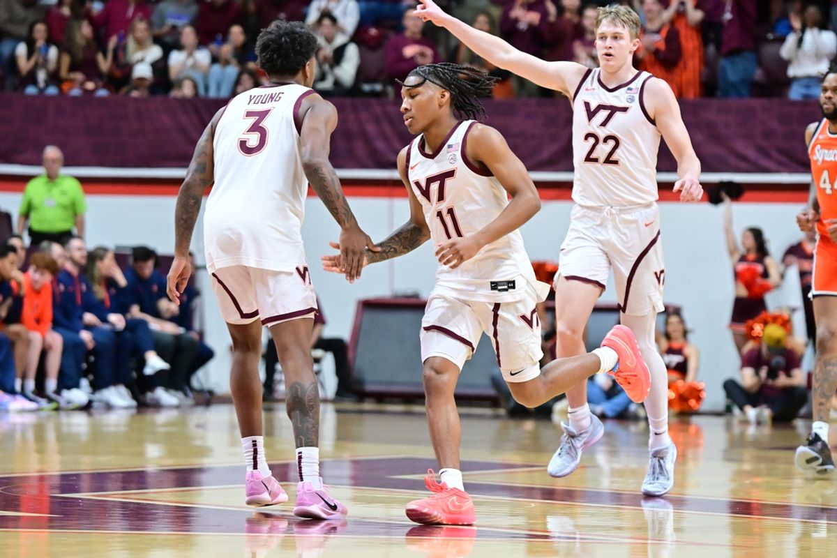 Mar 1, 2025; Blacksburg, Virginia, USA;  Virginia Tech Hokies guard Jaydon Young (3) congratulates Ben Hammond (11) after a three point basket during the first half against the Syracuse Orange at Cassell Coliseum. Mandatory Credit: Brian Bishop-Imagn Images