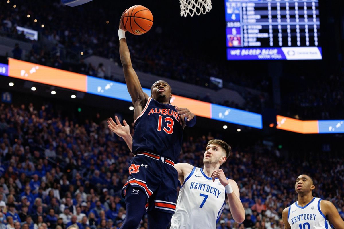 Mar 1, 2025; Lexington, Kentucky, USA; Auburn Tigers guard Miles Kelly (13) goes to the basket during the first half against the Kentucky Wildcats at Rupp Arena at Central Bank Center. Mandatory Credit: Jordan Prather-Imagn Images
