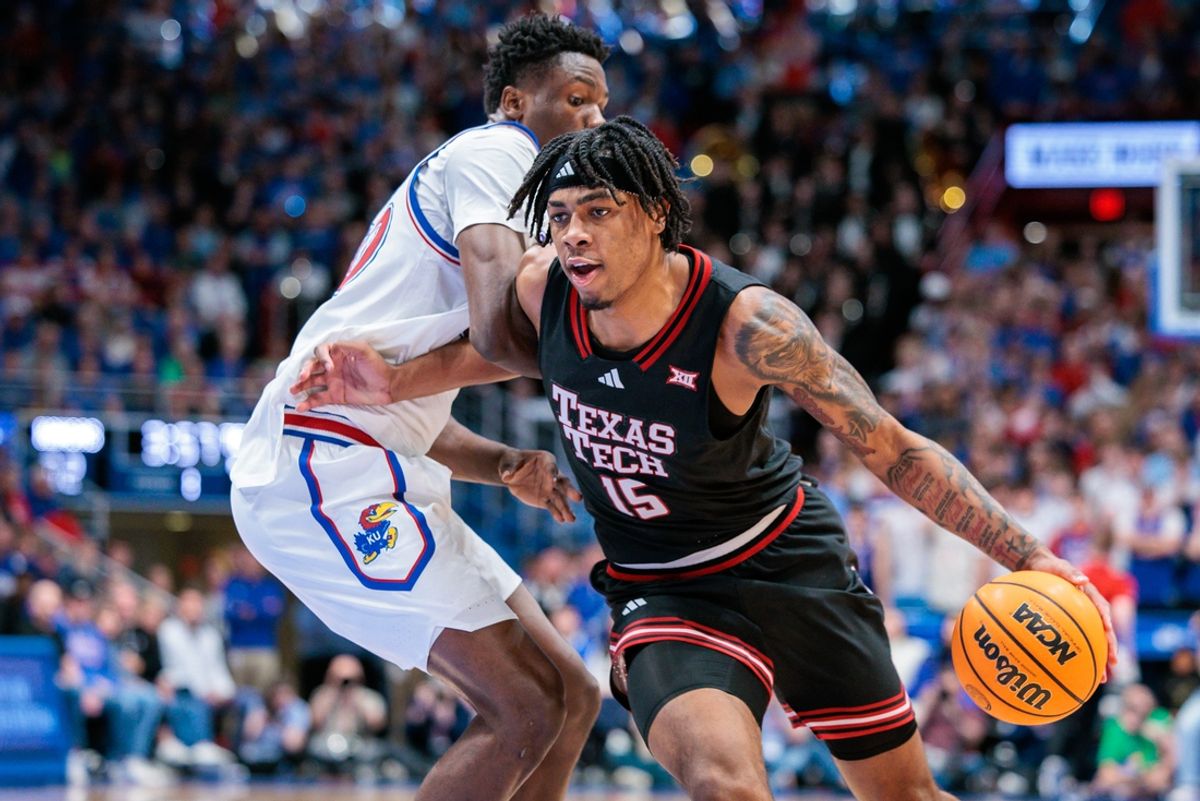 Mar 1, 2025; Lawrence, Kansas, USA; Texas Tech Red Raiders forward JT Toppin (15) drives to the basket during the first half against the Kansas Jayhawks at Allen Fieldhouse. Mandatory Credit: William Purnell-Imagn Images