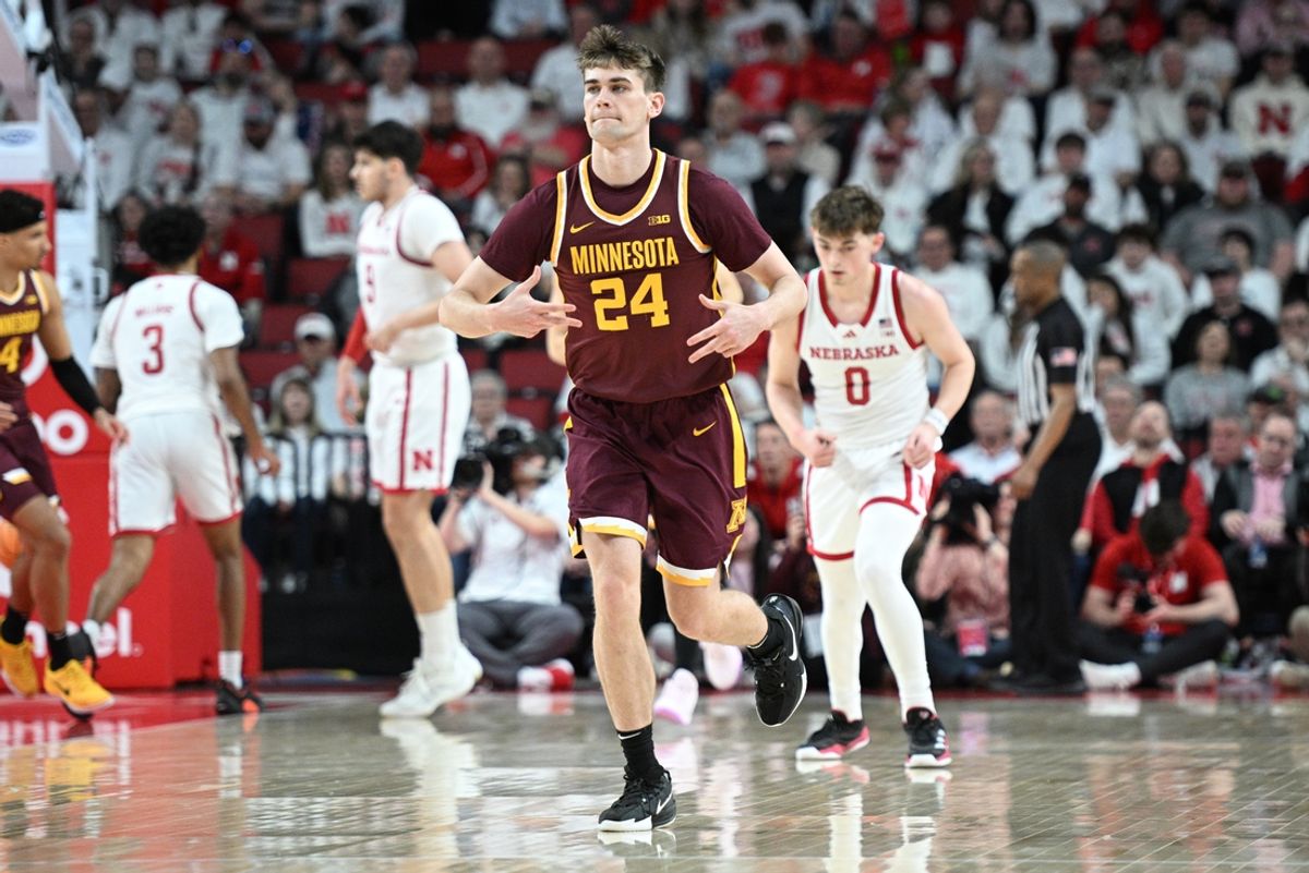 Mar 1, 2025; Lincoln, Nebraska, USA;  Minnesota Golden Gophers guard Brennan Rigsby (24) signals after making a three point attempt against the Nebraska Cornhuskers during the first half at Pinnacle Bank Arena. Mandatory Credit: Steven Branscombe-Imagn Images