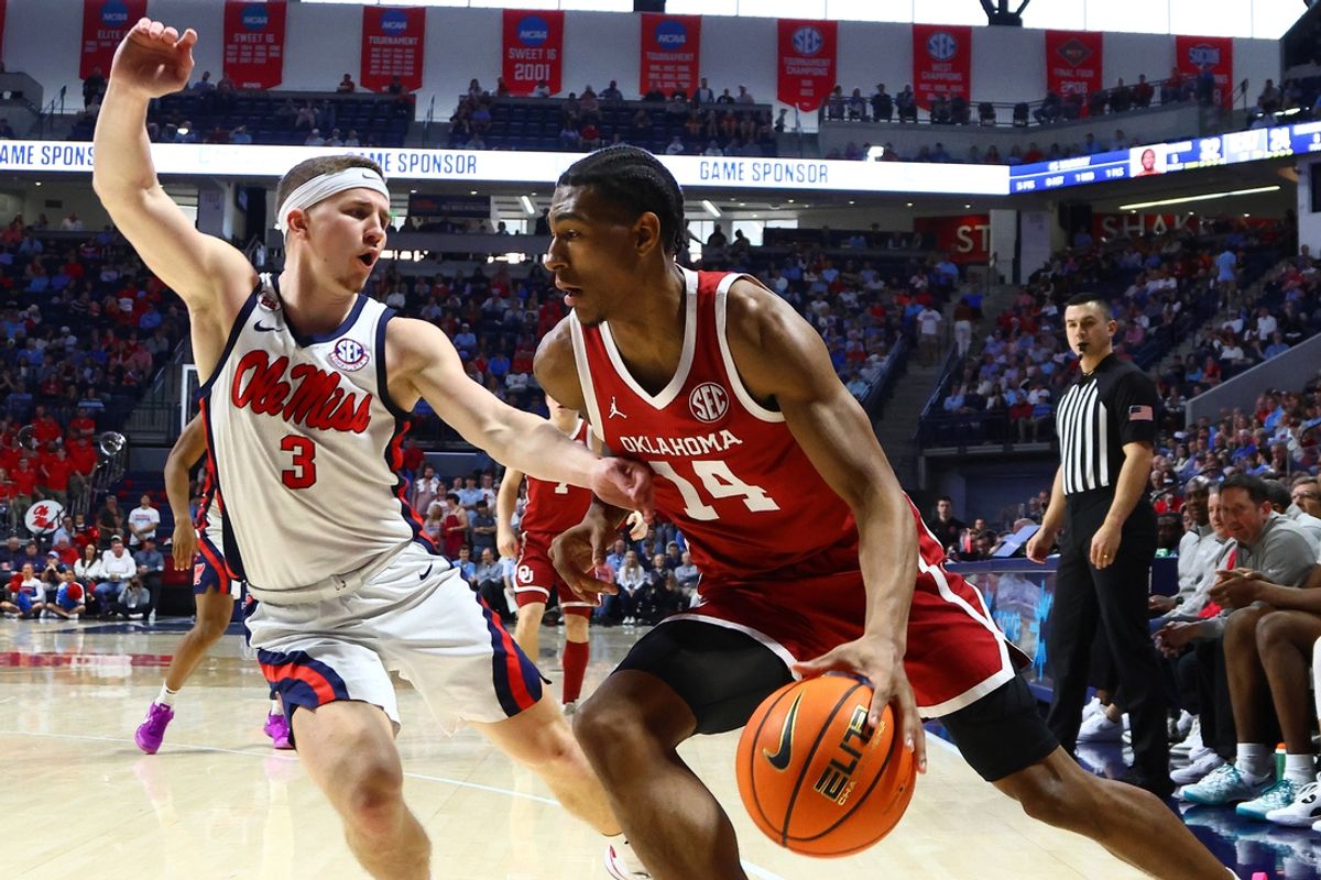 Mar 1, 2025; Oxford, Mississippi, USA; Oklahoma Sooners forward Jalon Moore (14) drives to the basket as Mississippi Rebels guard Sean Pedulla (3) defends during the first half at The Sandy and John Black Pavilion at Ole Miss. Mandatory Credit: Petre Thomas-Imagn Images