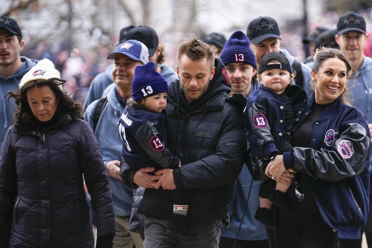 Mar 1, 2025; Columbus, Ohio, USA; The family of Johnny Gaudreau, Jane, left,  Meredith, right, and his children walk to Ohio Stadium before the NHL Stadium Series game between the Columbus Blue Jackets and the Detroit Red Wings at Ohio Stadium. Mandatory Credit: Samantha Madar/USA TODAY Network via Imagn Images