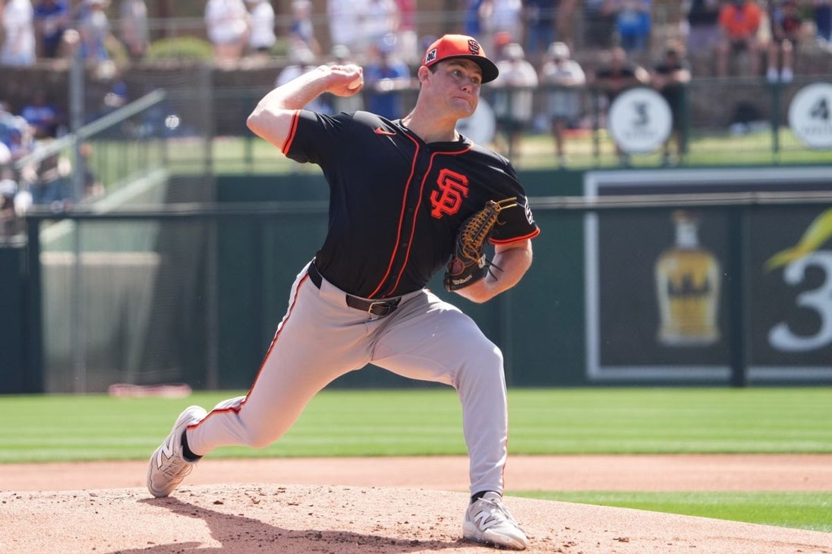 Mar 1, 2025; Phoenix, Arizona, USA; San Francisco Giants pitcher Carson Seymour (77) pitches against the Los Angeles Dodgers during the first inning at Camelback Ranch-Glendale. Mandatory Credit: Joe Camporeale-Imagn Images