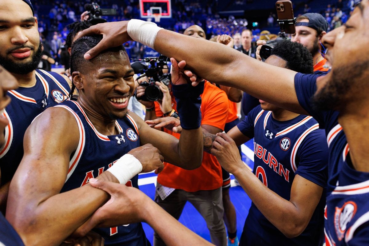 Mar 1, 2025; Lexington, Kentucky, USA; Auburn Tigers forward Chaney Johnson celebrates with guard Miles Kelly after the game against the Kentucky Wildcats at Rupp Arena at Central Bank Center. Mandatory Credit: Jordan Prather-Imagn Images