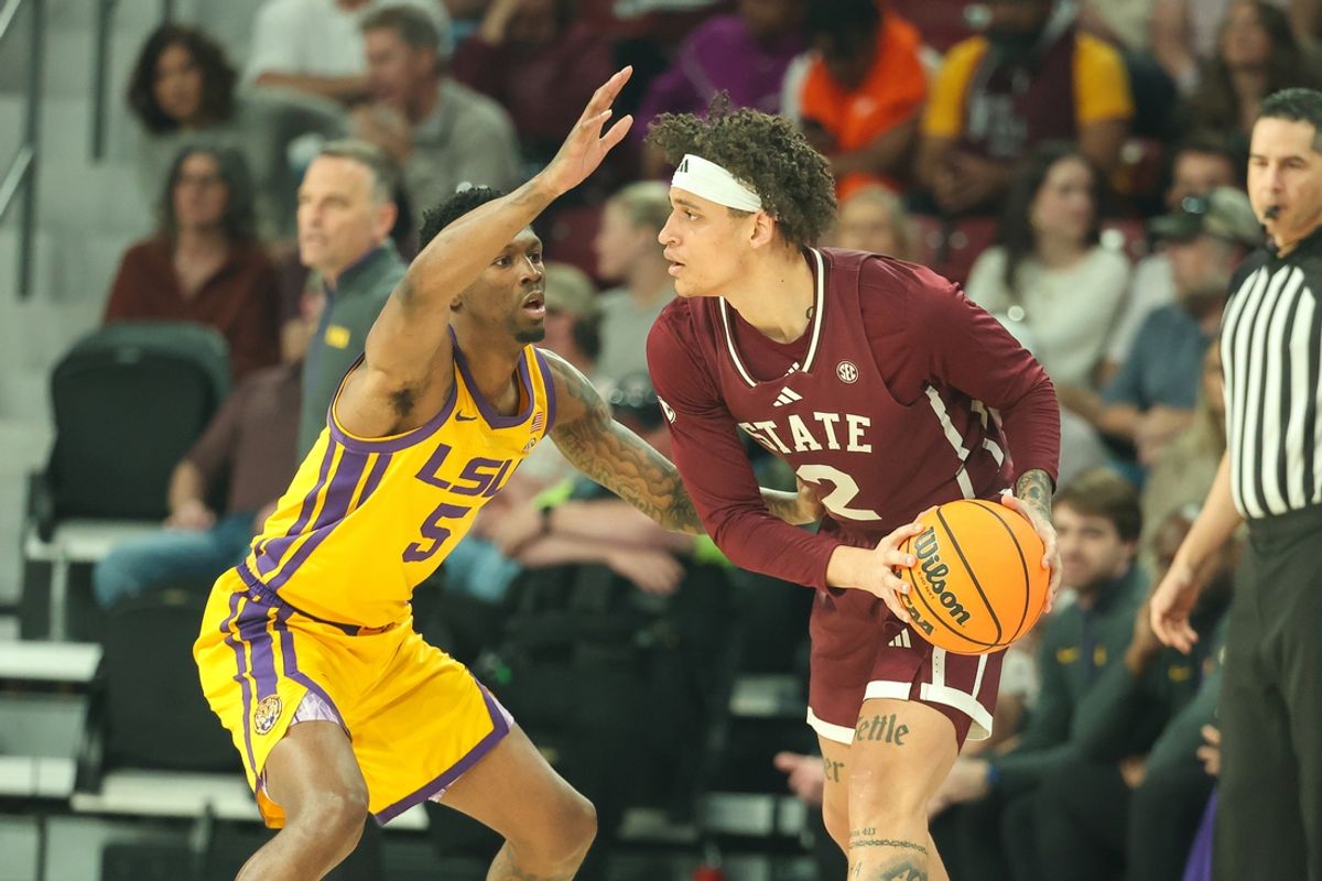 Mar 1, 2025; Starkville, Mississippi, USA; Mississippi State Bulldogs guard Riley Kugel (2) handles the ball as LSU Tigers guard Cam Carter (5) guards during the first half at Humphrey Coliseum. Mandatory Credit: Wesley Hale-Imagn Images