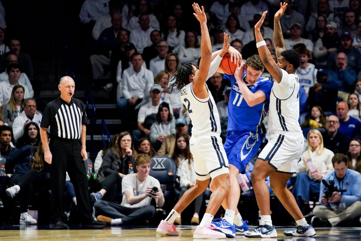Xavier Musketeers forwards Jerome Hunter (2) and John Hugley IV (4) double-team Creighton Bluejays center Ryan Kalkbrenner (11) in the first half of a NCAA men’s basketball game between the Xavier Musketeers and Creighton Bluejays, Saturday, March 1, 2025, at Cintas Center in Cincinnati.