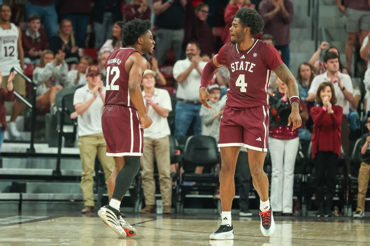 Mar 1, 2025; Starkville, Mississippi, USA; Mississippi State Bulldogs guard Josh Hubbard (12) and forward Cameron Matthews (4) celebrate during the second half against the LSU Tigers at Humphrey Coliseum. Mandatory Credit: Wesley Hale-Imagn Images